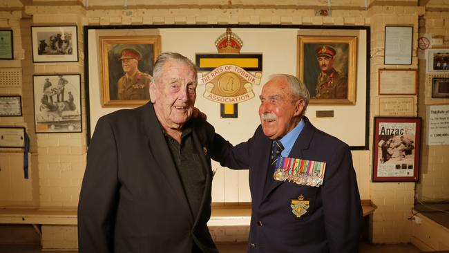 Brotherhood: Keith Clarkson, 96, and Bob Semple, 98, catch up at Tobruk House in Melbourne. See below for a young Semple in uniform. Picture:  Stuart McEvoy