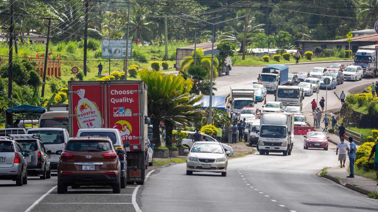 Cars are checked in Suva. Picture: Leon Lord/AFP