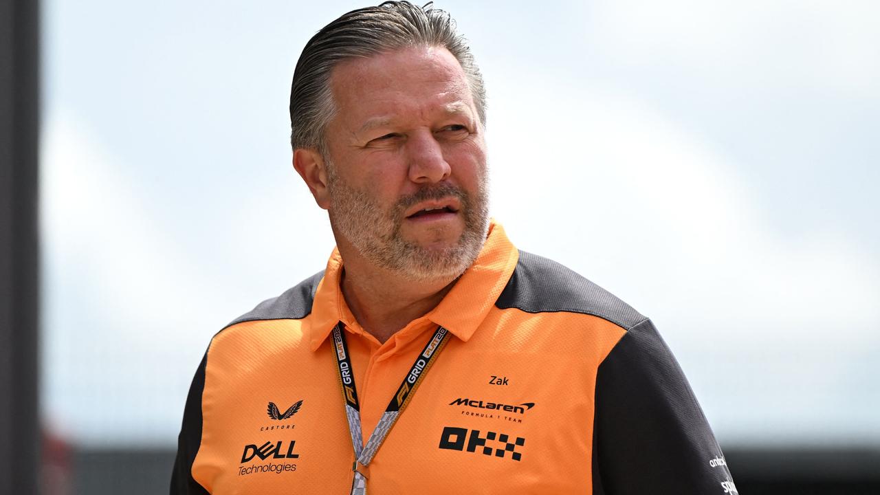 McLaren Racing's US CEO Zak Brown arrives in the paddock