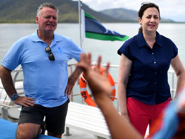 FITZROY ISLAND, AUSTRALIA - NewsWire Photos - OCTOBER 22, 2020.Queensland Premier Annastacia Palaszczuk and the Member for Cairns Michael Healy talk to an indigenous crew member onboard a reef cruise boat during a visit to Fitzroy Island, while on the election campaign trail. Ms Palaszczuk announced a $40 million investment in the protection of the Great Barrier Reef, should Labor win government. Queenslanders go to the polls on October 31.Picture: NCA NewsWire / Dan Peled