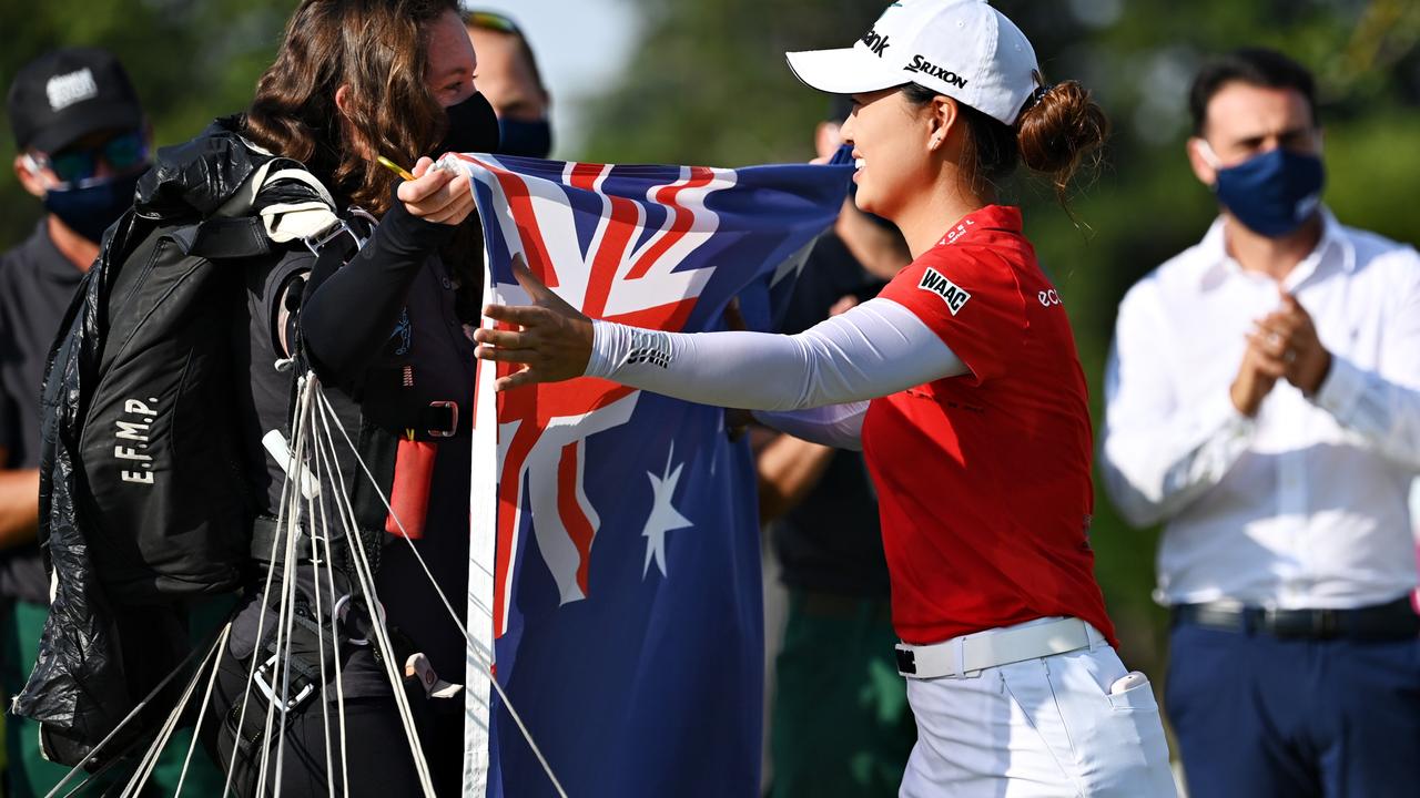 Minjee Lee of Australia is presented with an Australia flag in France. Picture: Stuart Franklin/Getty Images