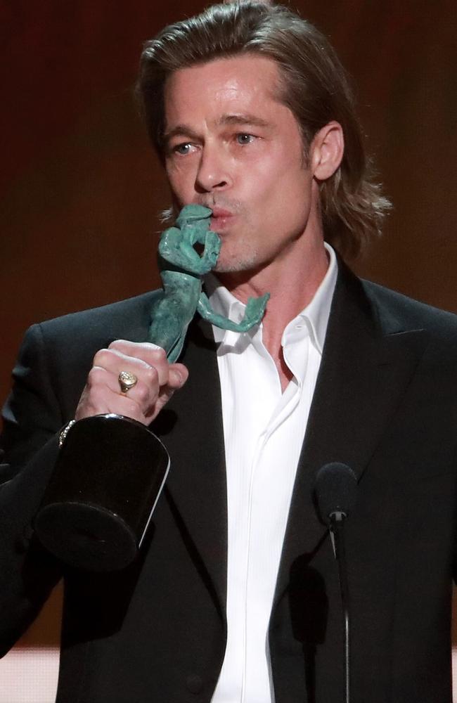 For his Tinder profile … Brad Pitt with his SAG Award. Picture: Getty Images