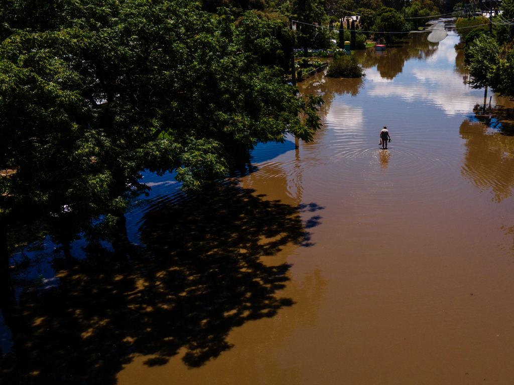 A resident walked through floodwater in Rochester, Australia, after severe weather warnings were issued for central Victoria following heavy rainfall. The floods, which caused widespread damage across the region, persisted for several days, with many residents forced to evacuate as floodwaters surged through towns. Picture: Getty