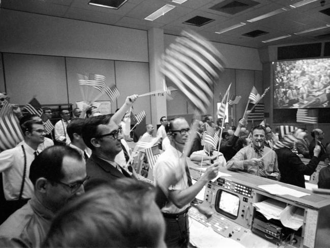 Flight controllers at the Mission Operations Control Room in Houston celebrate the successful conclusion of the Apollo 11 lunar landing mission. Picture: NASA via AP