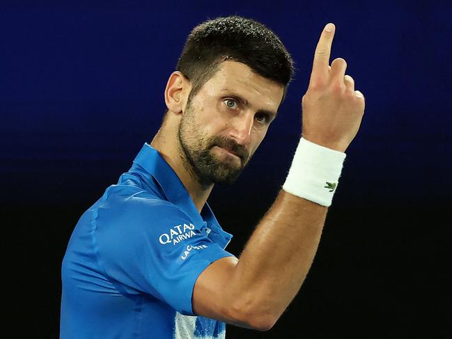 Serbia's Novak Djokovic reacts on a point against USA's Nishesh Basavareddy during their men's singles match on day two of the Australian Open tennis tournament in Melbourne on January 13, 2025. (Photo by DAVID GRAY / AFP) / -- IMAGE RESTRICTED TO EDITORIAL USE - STRICTLY NO COMMERCIAL USE --