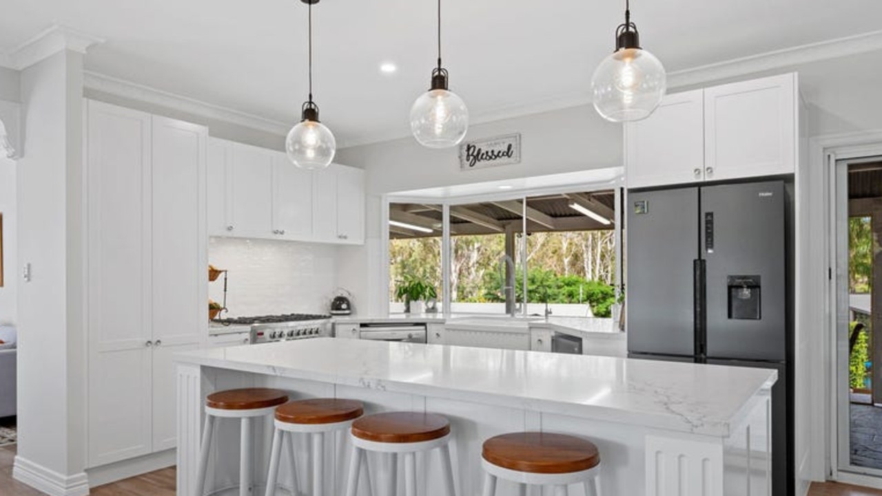 Island bench and servery window in the kitchen