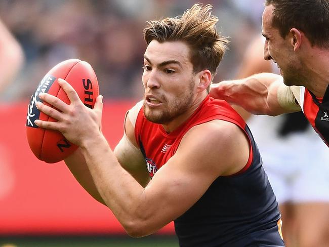 MELBOURNE, AUSTRALIA - AUGUST 13:  Jack Viney of the Demons is tackled by Luke Dunstan of the Saints during the round 21 AFL match between the Melbourne Demons and the St Kilda Saints at Melbourne Cricket Ground on August 13, 2017 in Melbourne, Australia.  (Photo by Quinn Rooney/Getty Images)