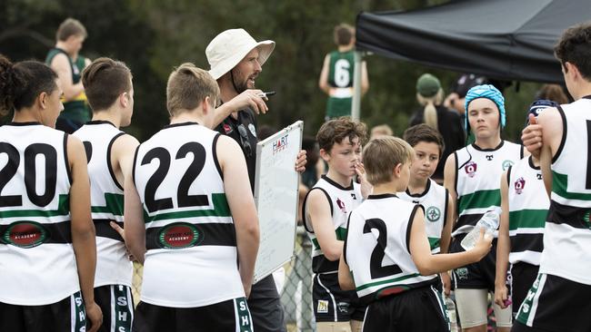 Park Ridge SHS coaches addresses his team. Picture: REnae Droop