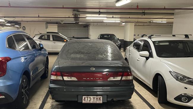 An abandoned Nissan Maxima 30G at the Uptown shopping complex car park. Photo: Supplied