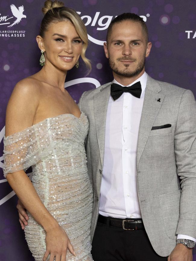 Former Essendon player David Zaharakis, pictured with partner Amy Pejkovic, is living up on Survivor.