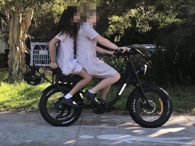 Secondary school students on an e-bike on a shared path in Manly, without helmets, where locals have been complaining about bikes speeding along footpaths at up to 30km/h. Picture: Jim O'Rourke