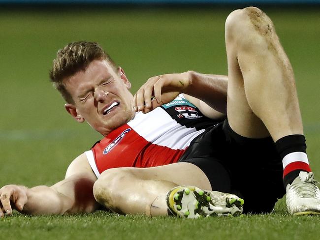 GEELONG, AUSTRALIA - AUGUST 14: Darragh Joyce of the Saints lays injured during the 2021 AFL Round 22 match between the Geelong Cats and the St Kilda Saints at GMHBA Stadium on August 14, 2021 in Geelong, Australia. (Photo by Dylan Burns/AFL Photos via Getty Images)