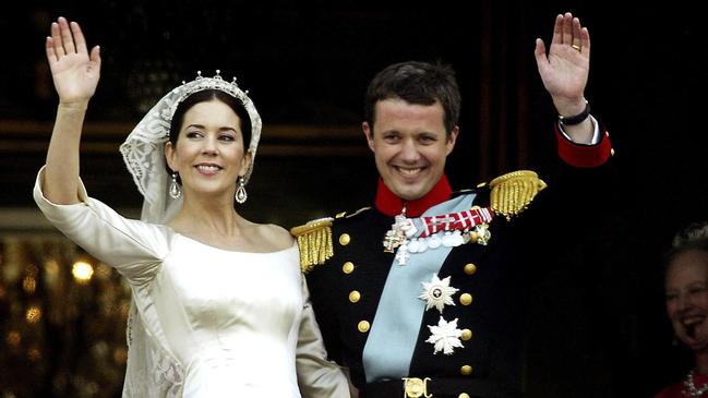 Crown Princess Mary and Crown Prince Frederik on the balcony of the Royal Palace of Amalienborg after their 2004 wedding. Picture: Getty Images.