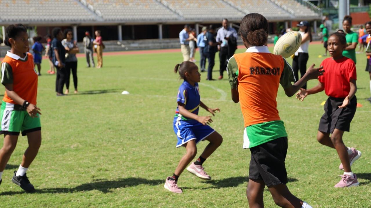 Girls in PNG practising NRL during Australian trade delegation visit to the Pacific Island. Picture: Supplied