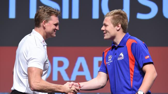 Nathan Buckley congratulates Jordan De Goey at the 2014 draft. Picture: AAP Images