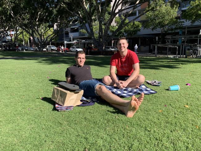 Beau Johnson Richard Samuta chose to spend the day appreciating the afternoon breeze with some takeaway. Picture: Isabella Magee