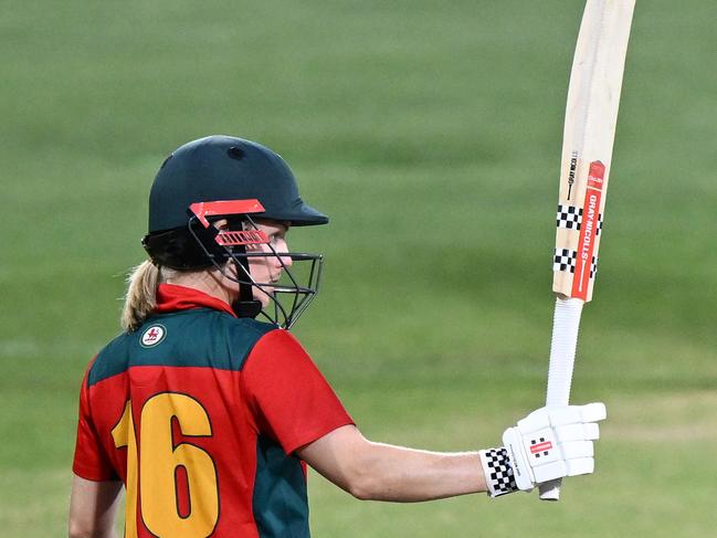 Nicola Carey acknowledges the crowd and her teammates after scoring her century. (Photo by Steve Bell/Getty Images)