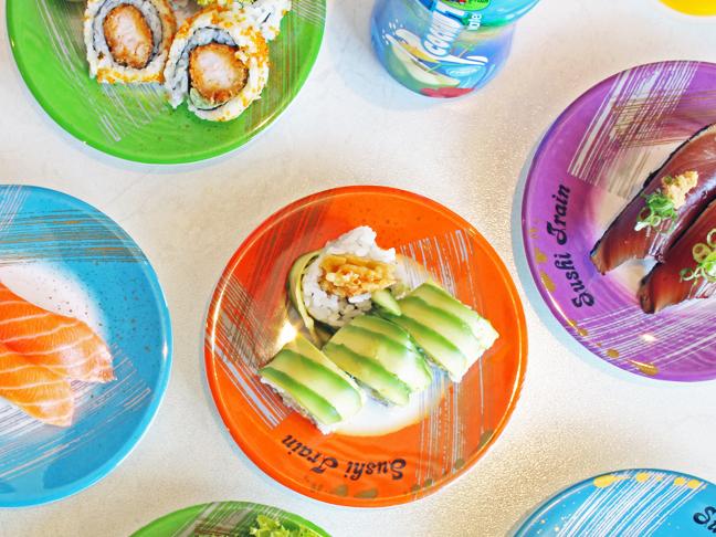 Sushi flat lay at sushi train