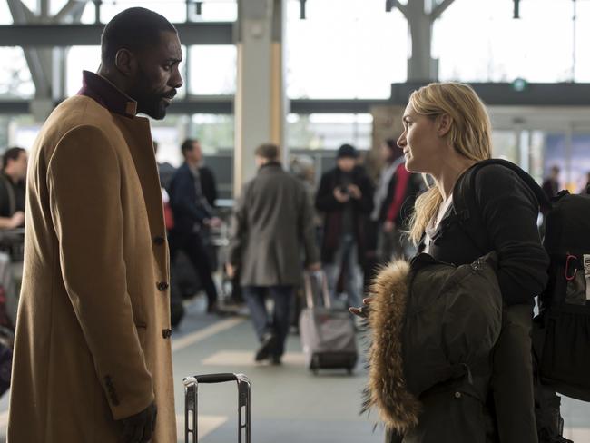 Kate Winslet, right, and Idris Elba have an ill-fated meeting in an airport in The Mountain Between Us.