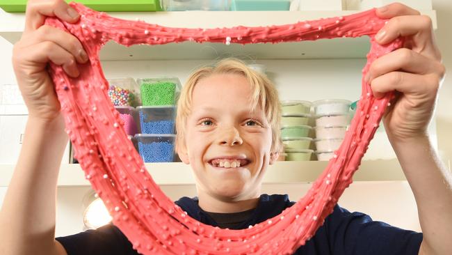 Connor Phillips, 12, with his slimy creations in Fairlight. He has started his own business called The Lonely Slime. Picture: Troy Snook