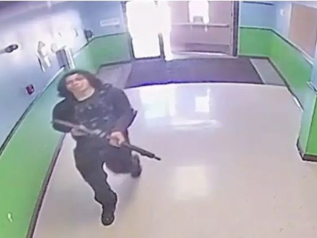 Salvador Ramos walking through the halls at the Robb Elementary School carrying an AR-15. Picture: Austin-American Statesman