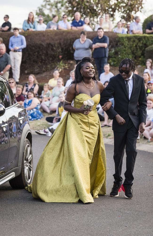 Graduate Clairy Mukeba with Enock Mukeba at Harristown State High School formal at Highfields Cultural Centre, Friday, November 17, 2023. Picture: Kevin Farmer