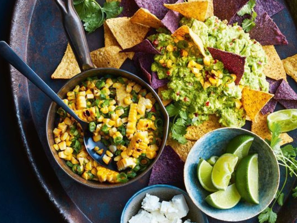 Smashed avocado nachos with barbecued corn salsa.