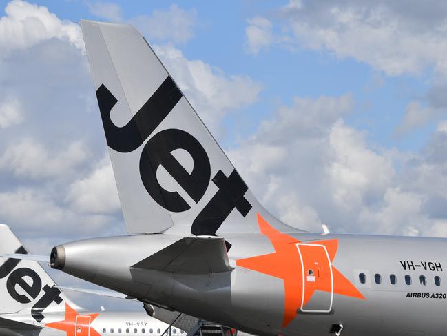 Jetstar and Virgin planes on the tarmac at Sunshine Coast Airport.