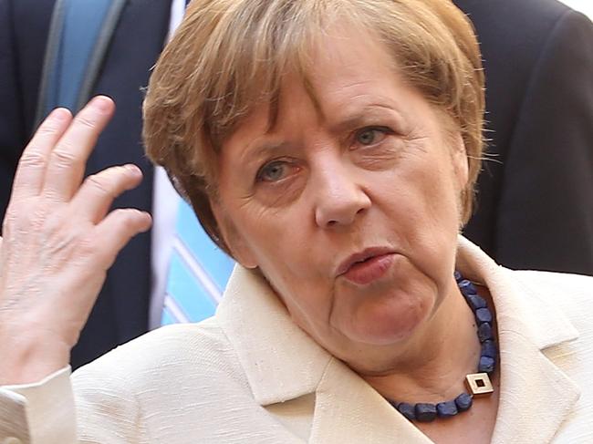 ROME, ITALY - MARCH 25:  Germany's Chancellor Angela Merkel gestures as she leaves the courtyard of the Musei Capitolini ahead of a special summit of EU leaders to mark the 60th anniversary of the bloc's founding Treaty of Rome on March 25, 2017 in Rome, Italy. The 60th anniversary of the signing of the treaties creating the European Economic Community and the European Atomic Energy Community the first major structural steps toward creating the European Union.  (Photo by Franco Origlia/Getty Images)