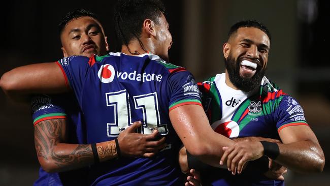 SYDNEY, AUSTRALIA - AUGUST 07: George Jennings of the Warriors celebrates after scoring a try with Adam Pompey and Eliesa Katoa of the Warriors during the round 13 NRL match between the Manly Sea Eagles and the New Zealand Warriors at Lottoland on August 07, 2020 in Sydney, Australia. (Photo by Cameron Spencer/Getty Images)