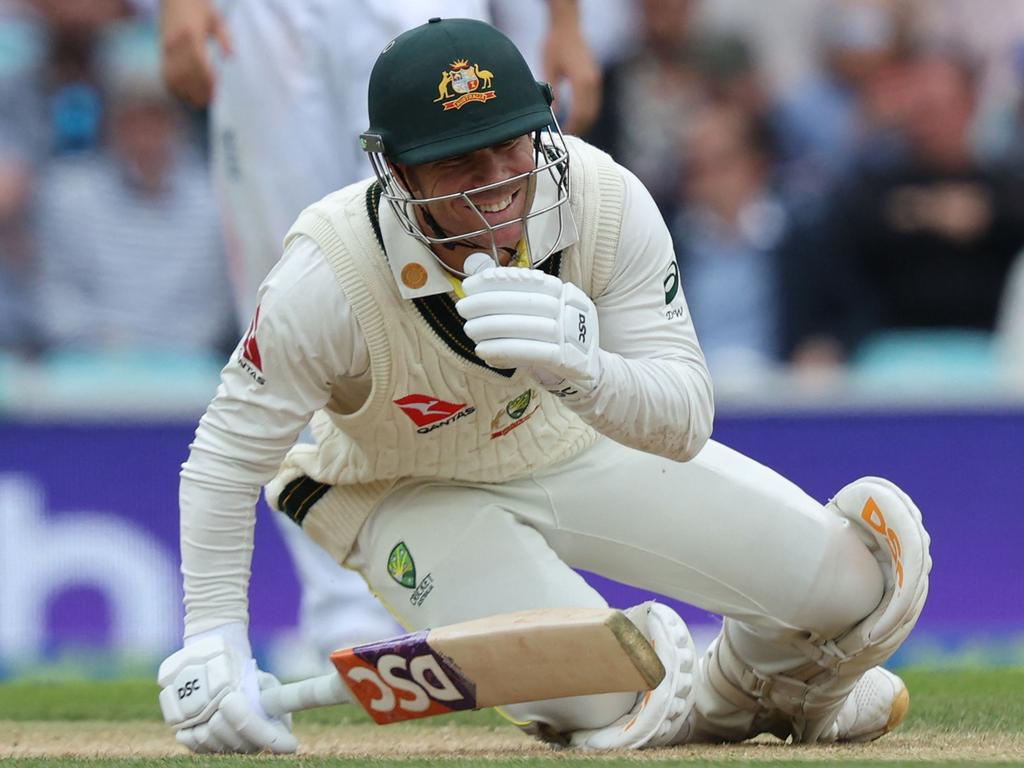 David Warner smiles after copping a beamer from James Anderson. Picture: Adrian Dennis/AFP