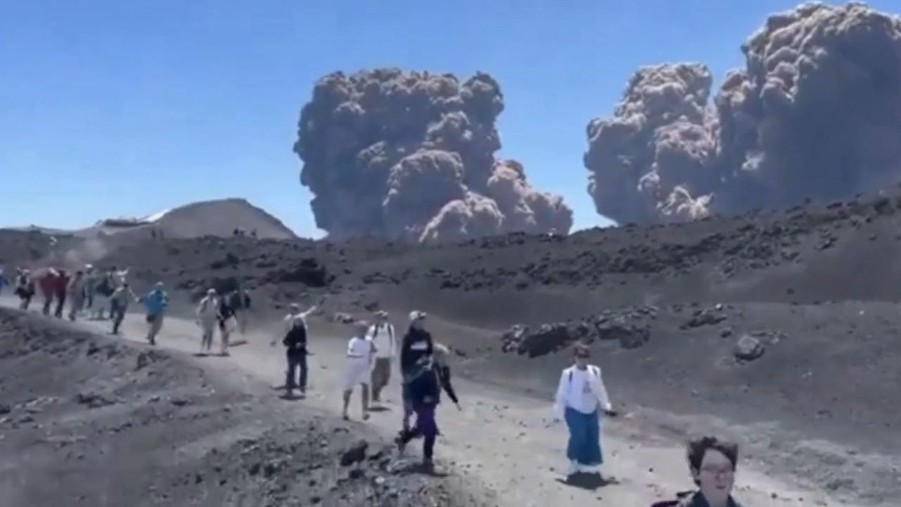 Tourist flee Mt Etna. Picture: Storyful/Aurelilien Pouzin.