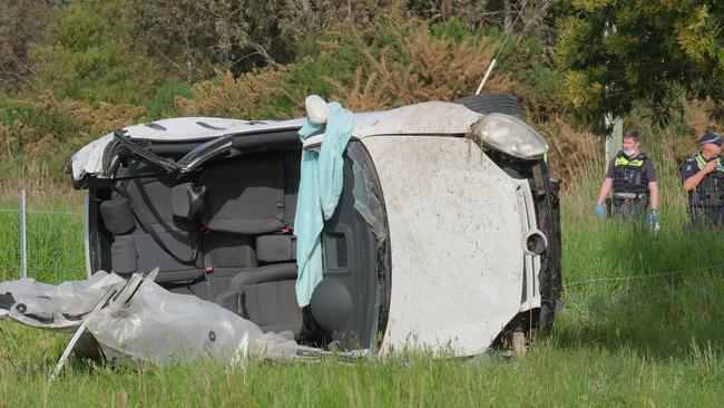 Police inspect the car after a crash off Hunts Rd at Moriac. Picture: Mark Wilson