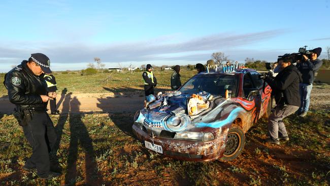 Protesters decorated a car depicting a lizard and were questioned by police. Picture: Tait Schmaal.