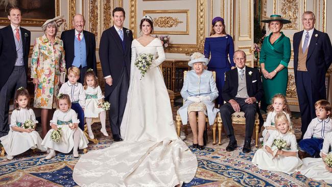 The official wedding photograph of Princess Eugenie and Jack Brooksbank in the White Drawing Room, Windsor Castle. (L-R back row) Thomas Brooksbank; Nicola Brooksbank; George Brooksbank; Princess Beatrice of York; Sarah, Duchess of York; Britain's Prince Andrew, Duke of York, (L-R middle row) Prince George of Cambridge; Princess Charlotte of Cambridge; Queen Elizabeth II; Britain's Prince Philip; Maud Windsor; Louis De Givenchy; (L-R front row) Theodora Williams; Mia Tindall; Isla Phillips. Picture: AFP.