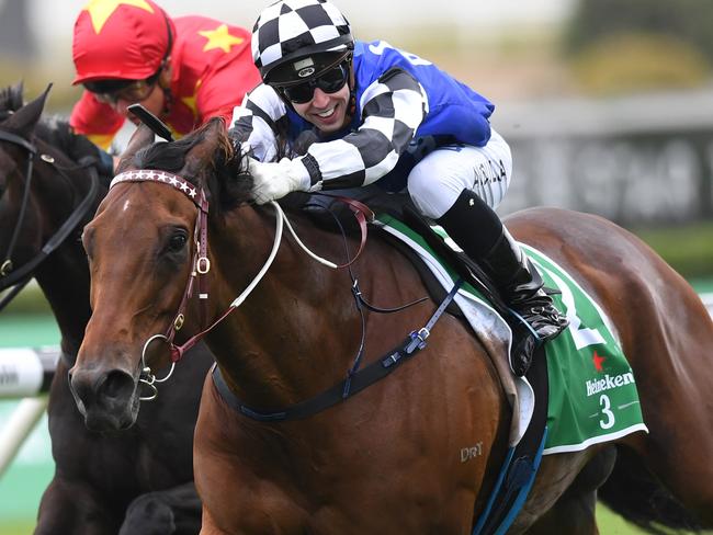 Big Duke and Brenton Avdulla surge to victory in the St Leger Stakes. Picture: AAP