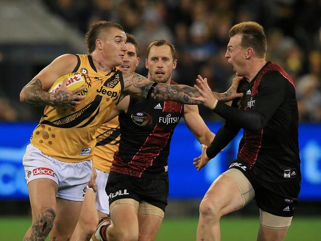 Dustin Martin throws out his trademark “don’t argue” on Brendon Goddard. Picture: Wayne Ludbey