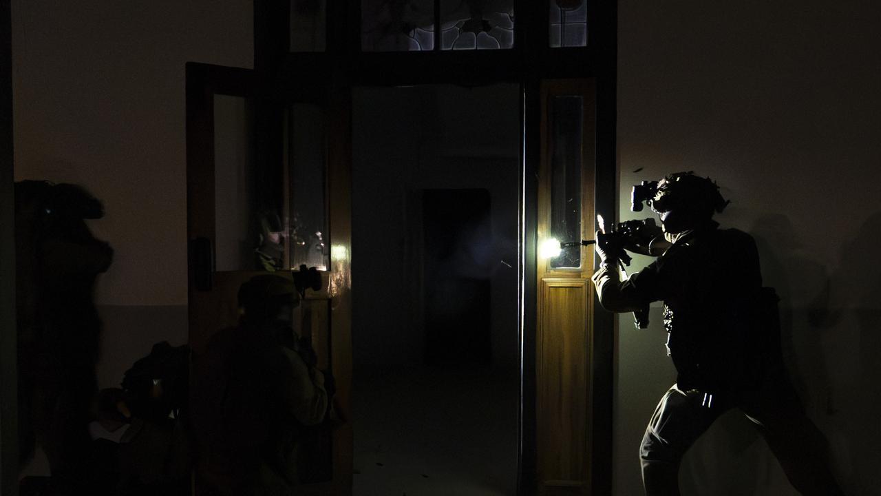 North Queensland Warfighter multi-nation military exercises in the Ingham region. Australian Army soldiers from the 1st Battalion, The Royal Australian Regiment conduct a clearance at a night raid during the North Queensland Warfighter Exercise in Ingham. Picture: Supplied