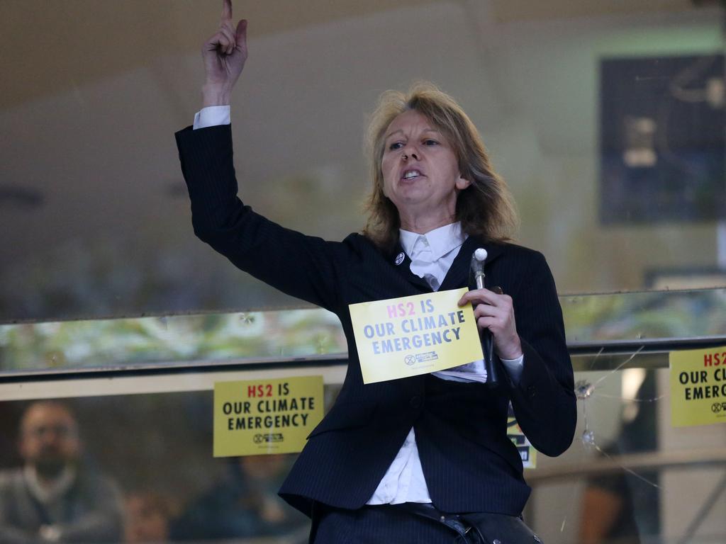 Gail Bradbrook, co-founder of the Extinction Rebellion climate action movement, speaks before smashing a window at Britain’s Transport Department. Picture: Isabel Infantes/AFP