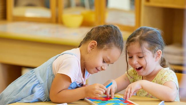 Kindergarten children Ava Sinopoli and Isla Balk-Dartnell at Cubby Care's Mooroobool centre. Picture: Romy Photography