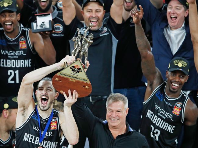 Mitchell, top right, celebrates the 2018 NBL title at United — he’s striving for the same success as head coach of the Phoenix. Picture: Getty Images