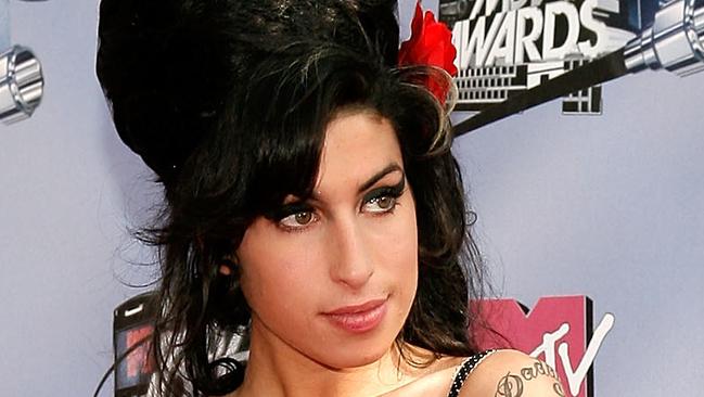 UNIVERSAL CITY, CA - JUNE 03: **6 MONTHS WEBSITE RIGHTS EMBARGO** Musician Amy Winehouse arrives to the 2007 MTV Movie Awards held at the Gibson Amphitheatre on June 3, 2007 in Universal City, California. (Photo by Vince Bucci/Getty Images for MTV)