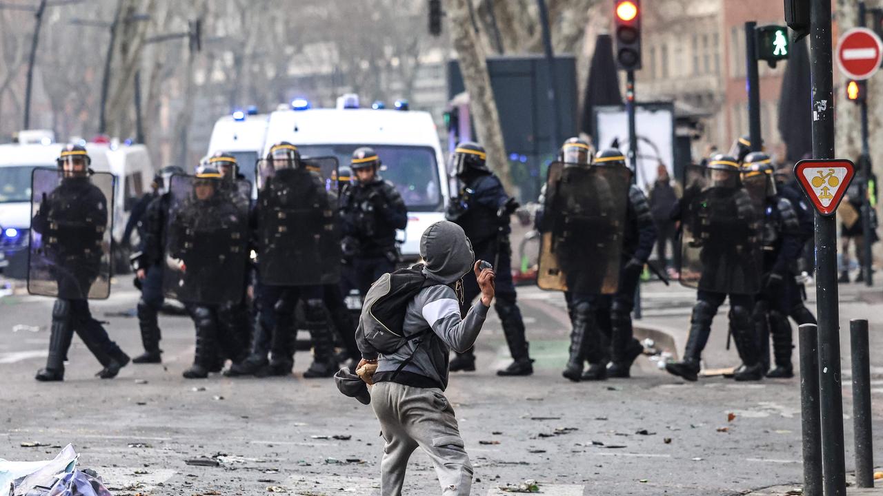 A protester throws an object during a demonstration as violence erupted in Paris. Picture: AFP