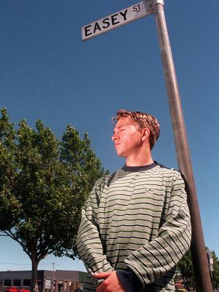 Greg Armstrong stands in Easey St, Collingwood near the house where his mother was murdered in 1977.