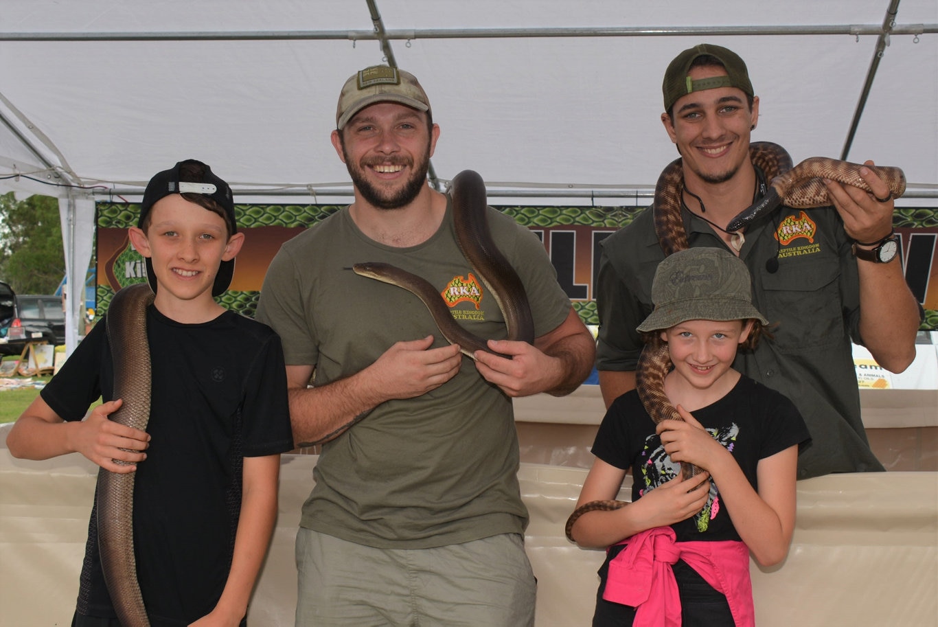 Brendan and Freya Appledorn from Kingaroy with Hugh Bason and Jaedon Lunt from Reptile Kingdom Australia at the Cooyar Show. Picture: Kate McCormack