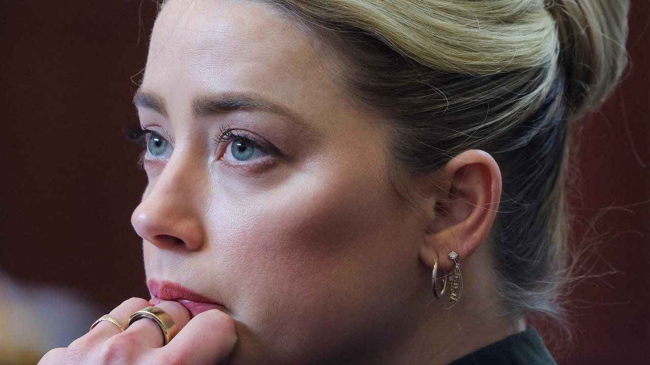 Amber Heard could be seen welling up as the text was read out. (Photo by EVELYN HOCKSTEIN / POOL / AFP)