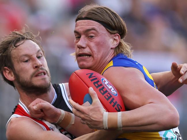 PERTH, AUSTRALIA - JUNE 01: Harley Reid of the Eagles gets tackled by Jimmy Webster of the Saints during the round 12 AFL match between West Coast Eagles and St Kilda Saints at Optus Stadium, on June 01, 2024, in Perth, Australia. (Photo by Paul Kane/Getty Images)