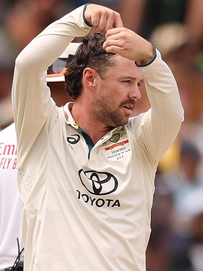 Travis Head of Australia celebrates the wicket of Rishabh Pant of India during day five of the Men's Fourth Test Match in the series between Australia and India Picture: Morgan Hancock