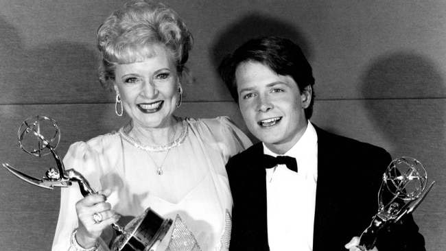 Betty White and Michael J. Fox backstage with their Emmy awards in 1986. Picture: Getty