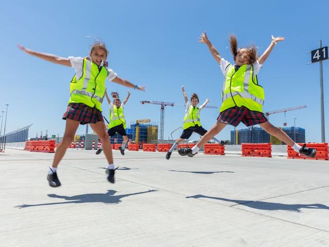 Lindisfarne Anglican Grammar School year three students at the Gold Coast airport ready to name the cranes. Ivy Thomson, Wallace Thompson, Archie Wilson and Sana Rice.